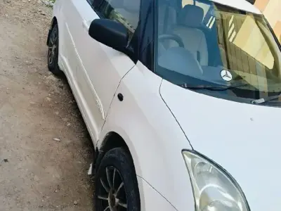 White Maruti Swift VDi Diesel Car White Maruti Swift VDi Diesel Car