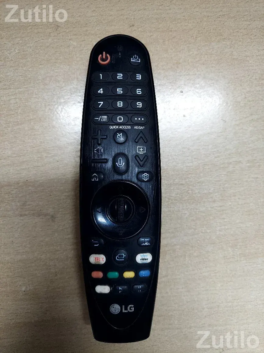 LG smart TV with a matching black remote control - ટીવી - સુરત શહેર - Image 2