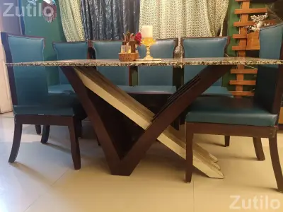 Heavy sagun dinning table with marble lop. Beautiful six chair Heavy sagun dinning table with marble lop. Beautiful six chair