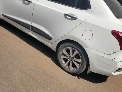 White Compact Sedan with Alloys White Compact Sedan with Alloys
