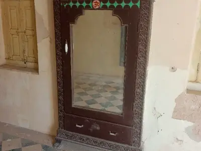 Carved Wooden Wardrobe with Mirror and Drawer
