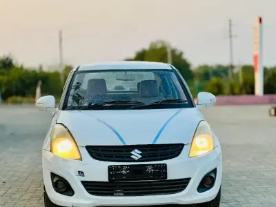White Maruti Swift Dzire Sedan Car White Maruti Swift Dzire Sedan Car